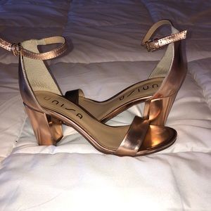 Rose gold heels.